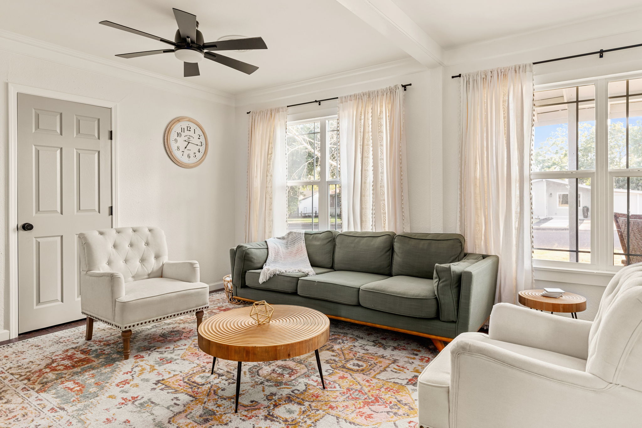 Living room wide view with large windows