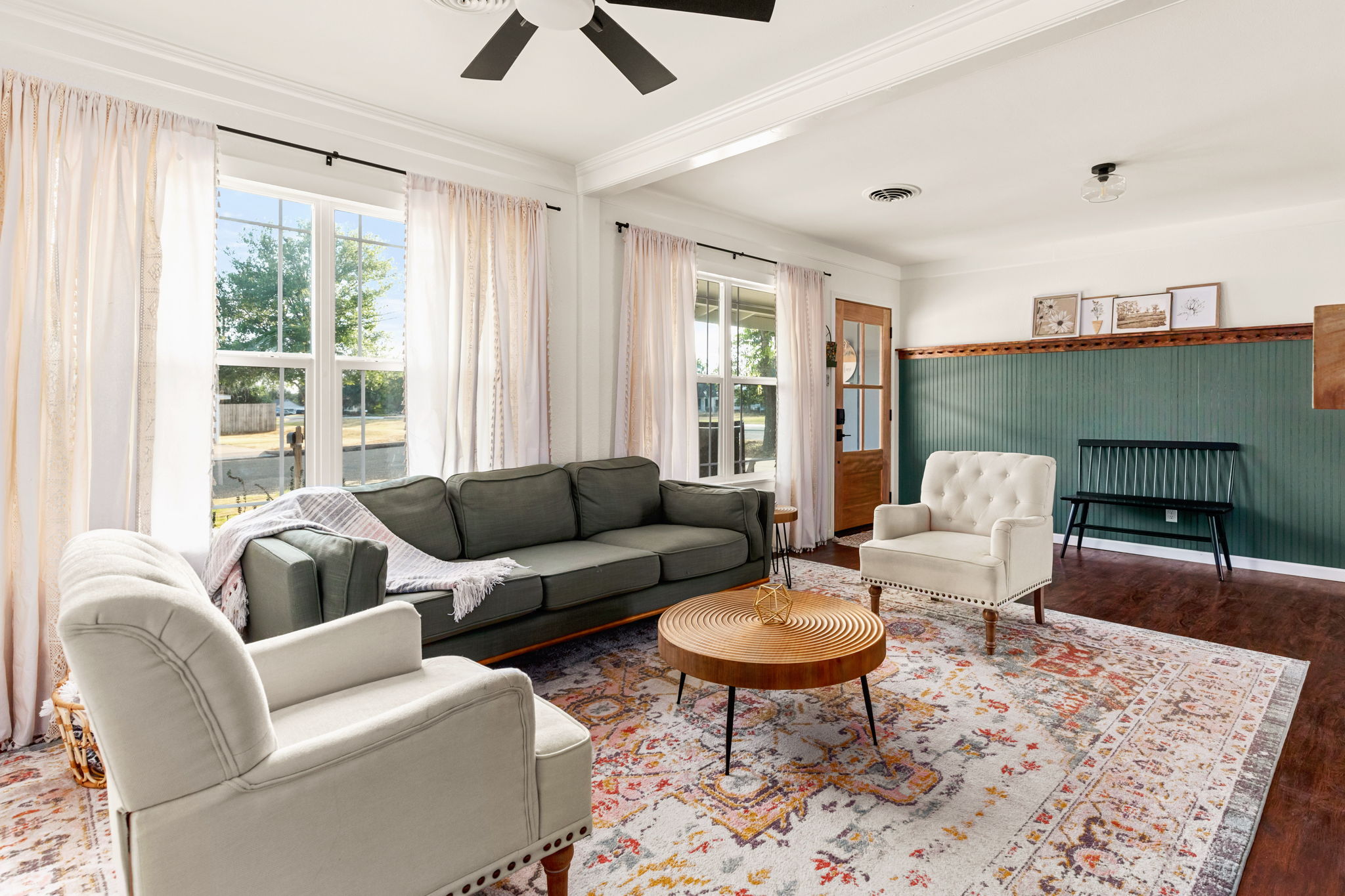Living room showing entry and green beadboard