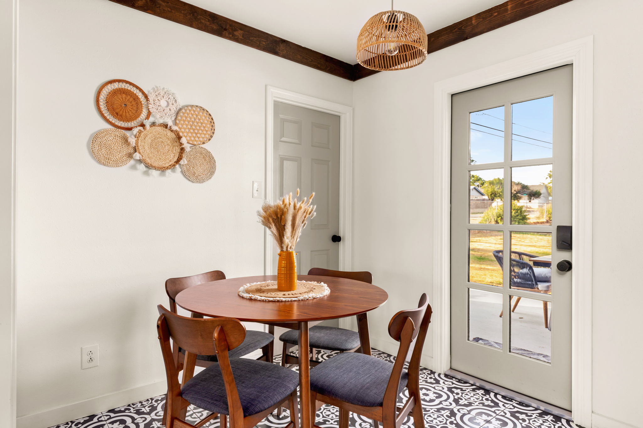 Dining area with boho woven wall plates