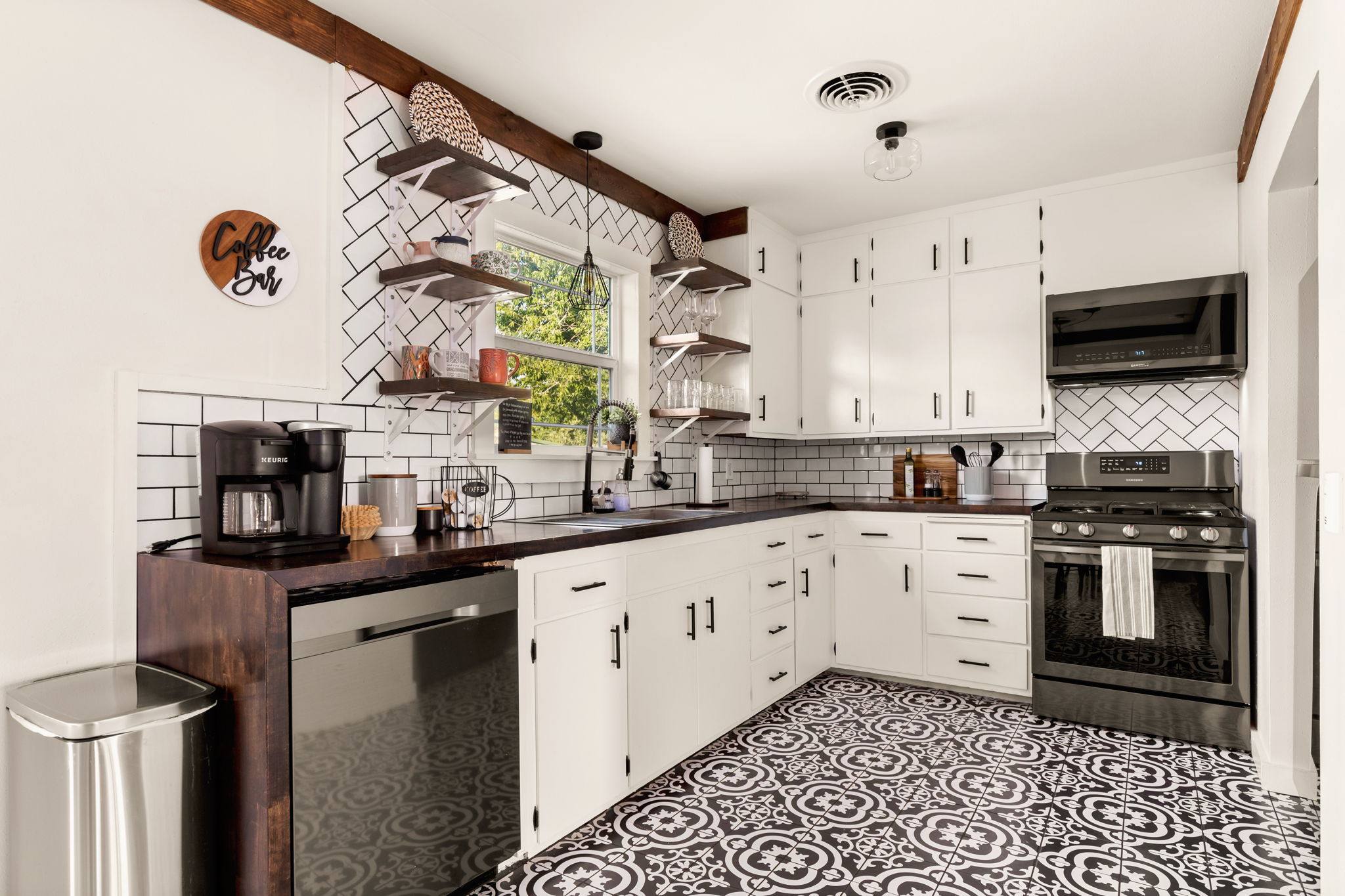 Fully equipped kitchen with patterned tile floors