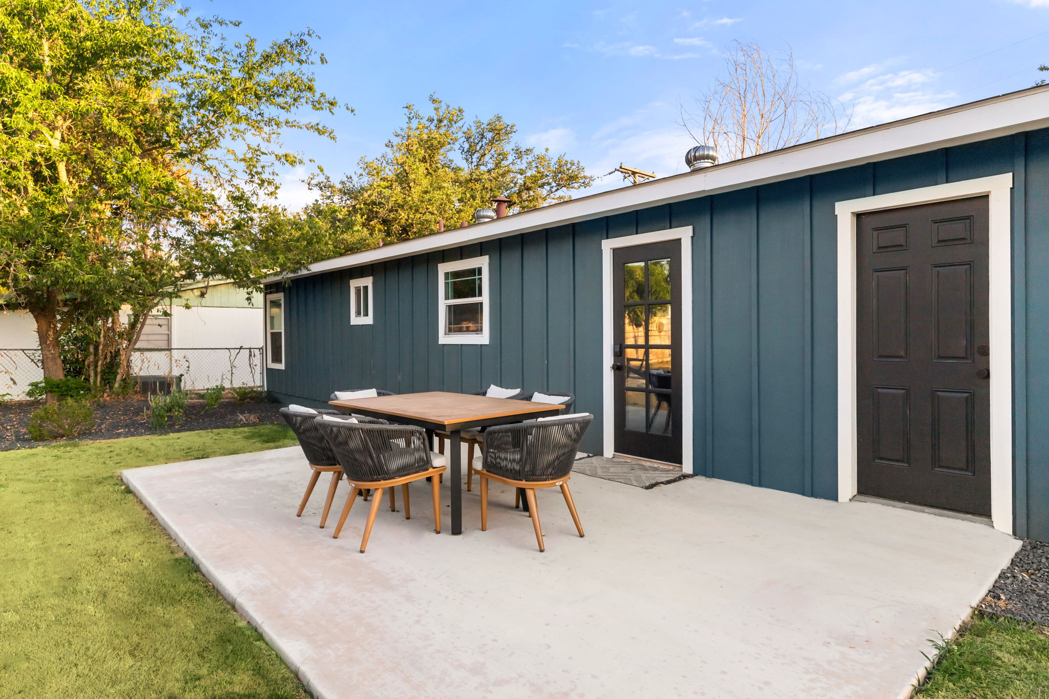 Back patio with outdoor dining table