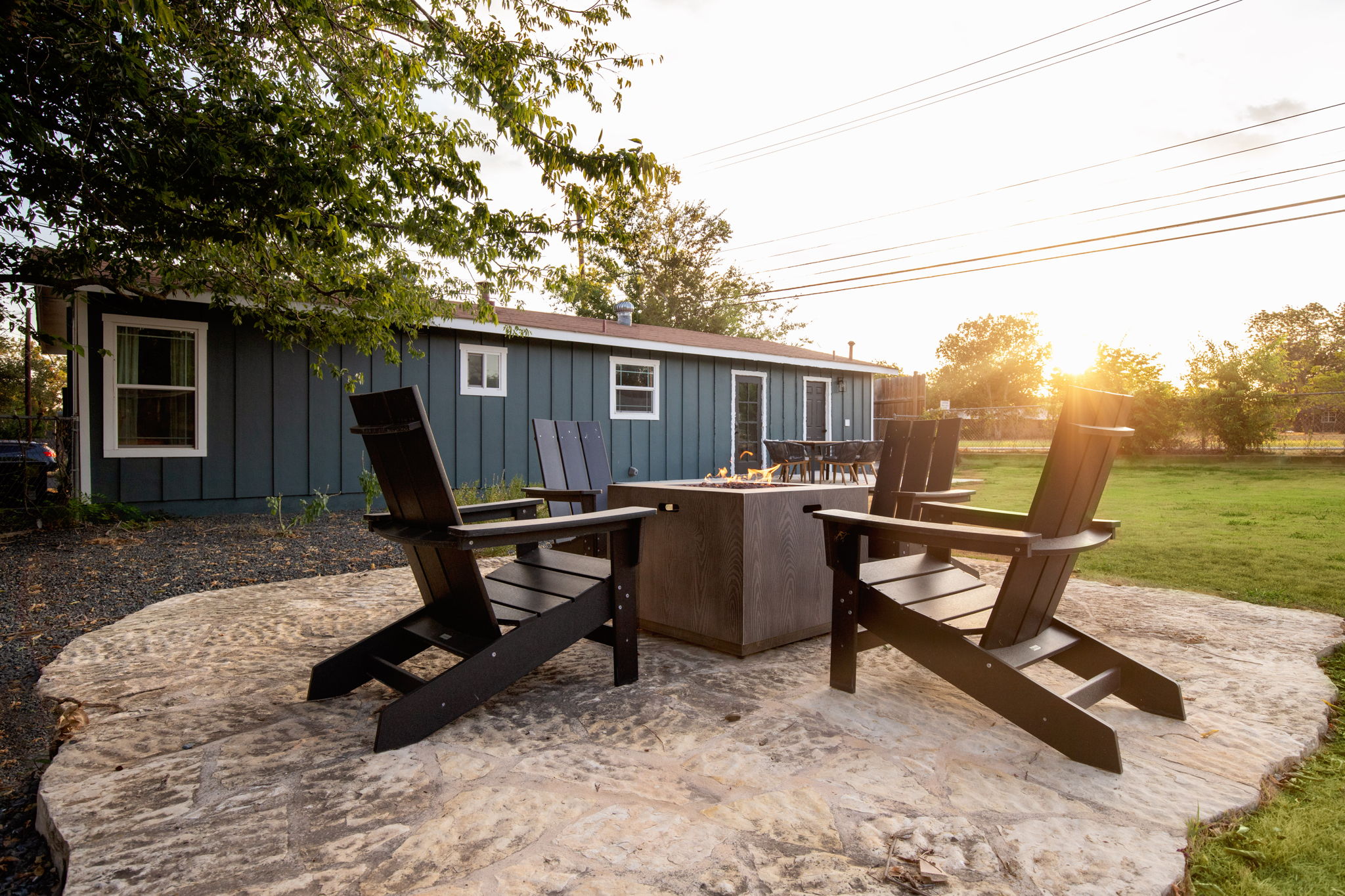 Fire pit Adirondack chairs at golden hour